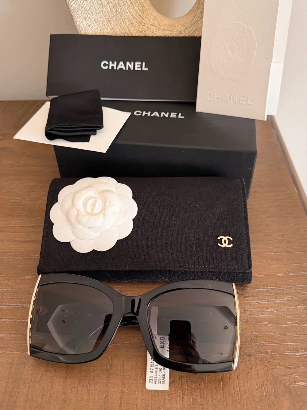 CHANEL Black Cat-Eye Sunglasses with Gold Accent and Gradient Gray Lenses